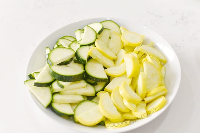 A bowl of zucchini and squash slices cookingwithcurls.com
