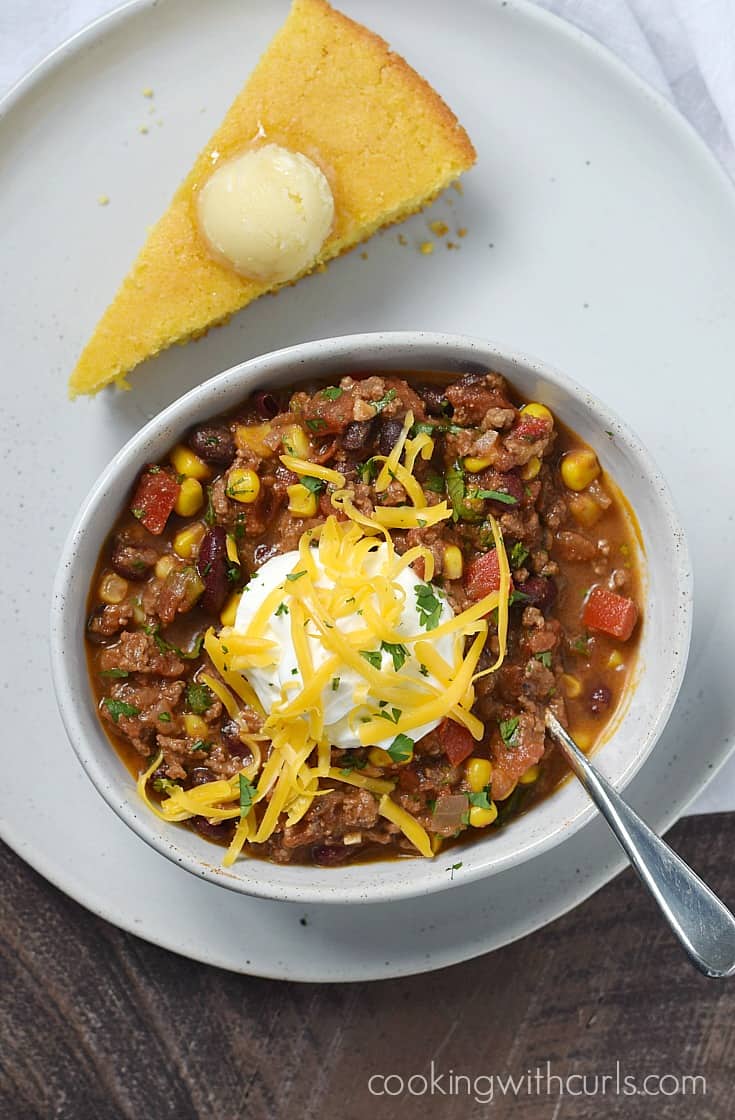 A nice big bowl of Southwest Chili with Black Beans and Corn is exactly what you need to warm you up on a cold, winter night | cookingwithcurls.com