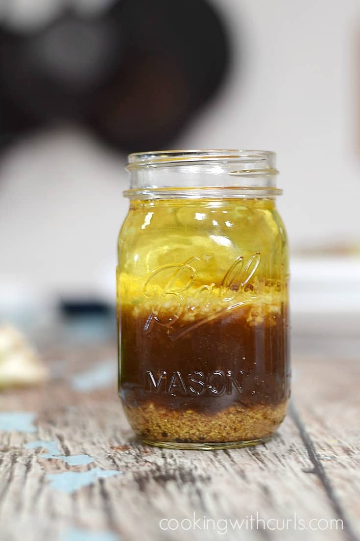 Asian Orange-Ginger Dressing in a glass mason jar.