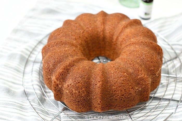 Baked Bacardi Pina Colada Rum Cake on a wire cooling rack. 