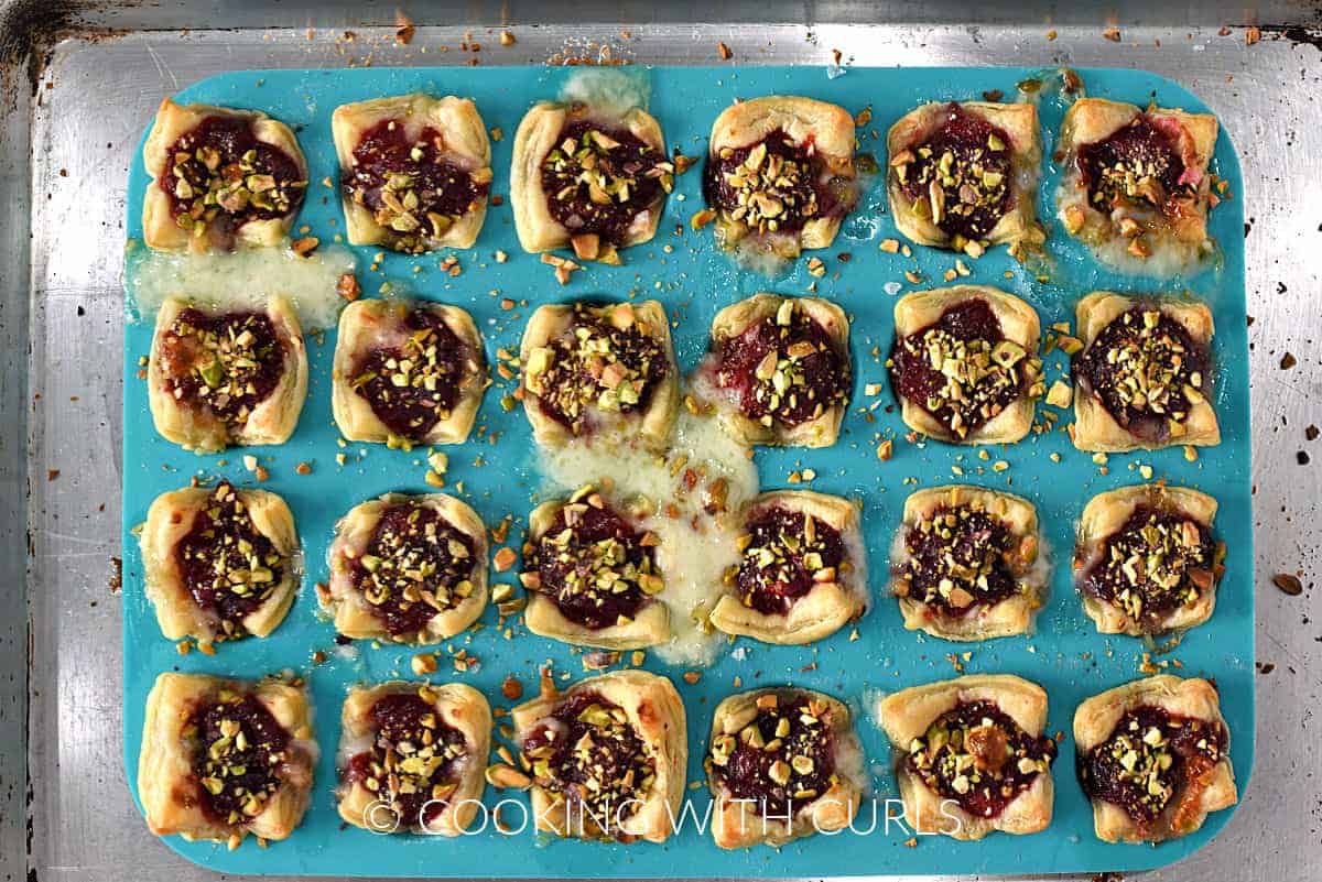 Baked cranberry brie bites in a min muffin pan. 