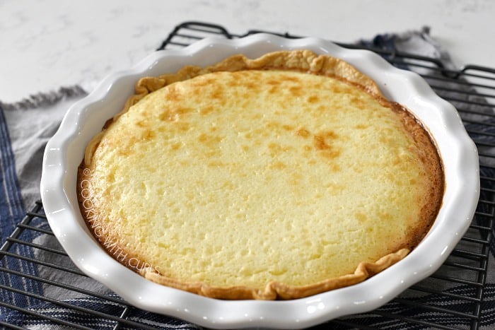 Baked Pina Colada Pie sitting on a metal cooling rack 