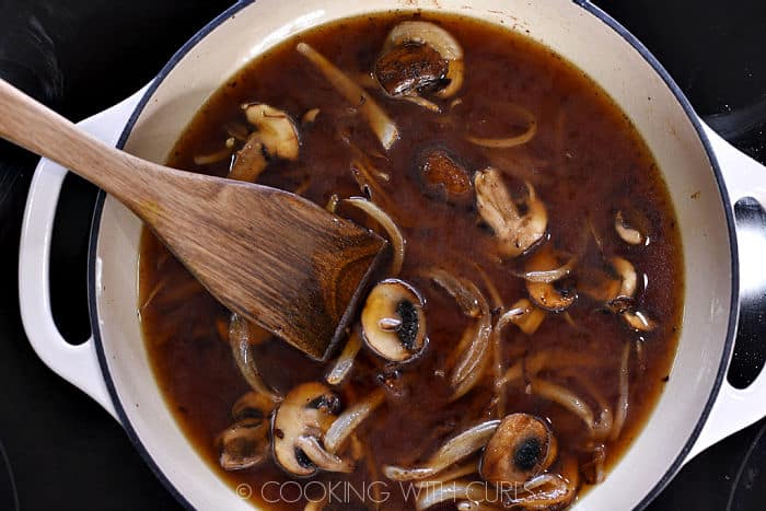 Beef stock added to the mushrooms and onions. 