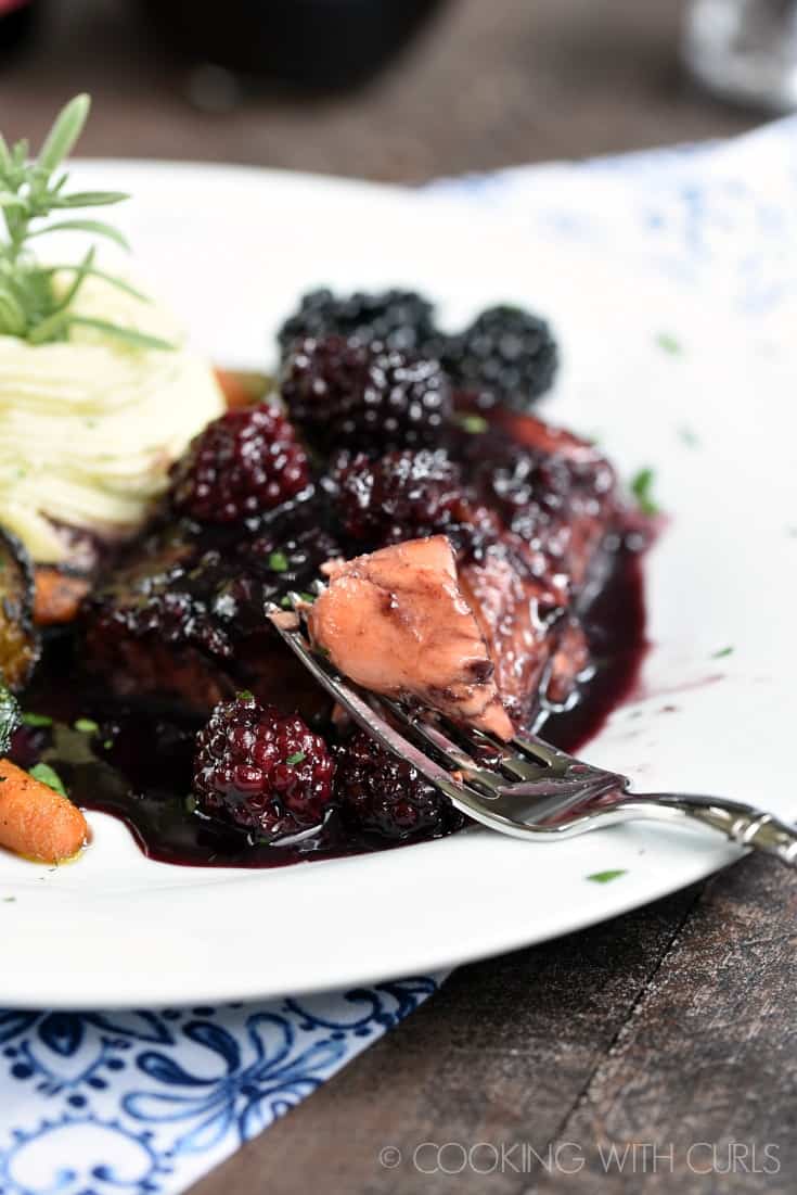 Blackberry Bourbon Glazed Salmon - tender, flaky salmon cooked in a sweet and tangy blackberry sauce create an outstanding meal that is sure to impress!