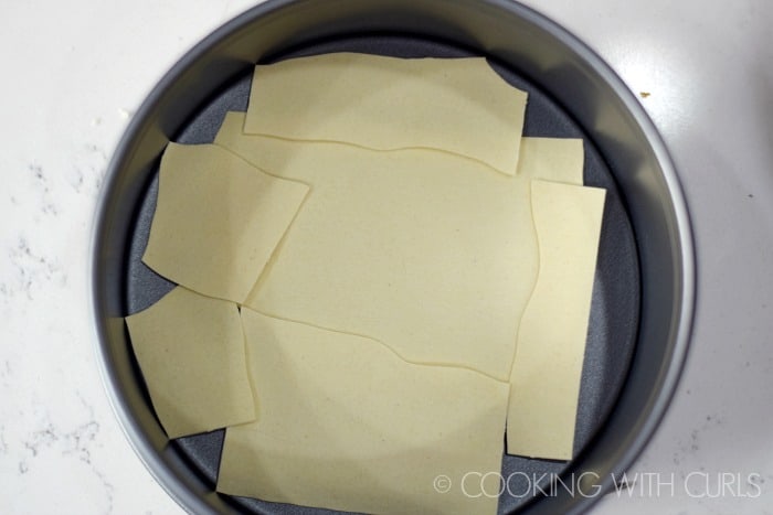 Break the noodles to fit them into the springform pan