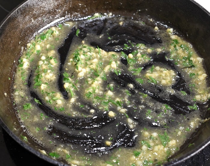 Butter, oil, lemon zest, garlic and parsley in a cast iron skillet