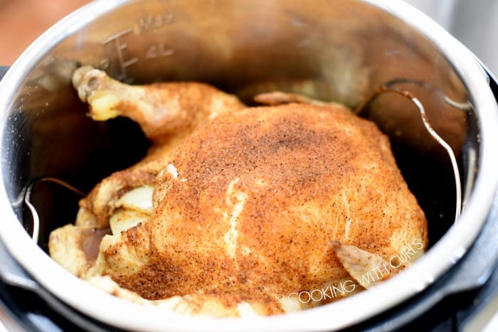 Carefully remove the lid to unveil the perfectly cooked whole chicken cookingwithcurls.com