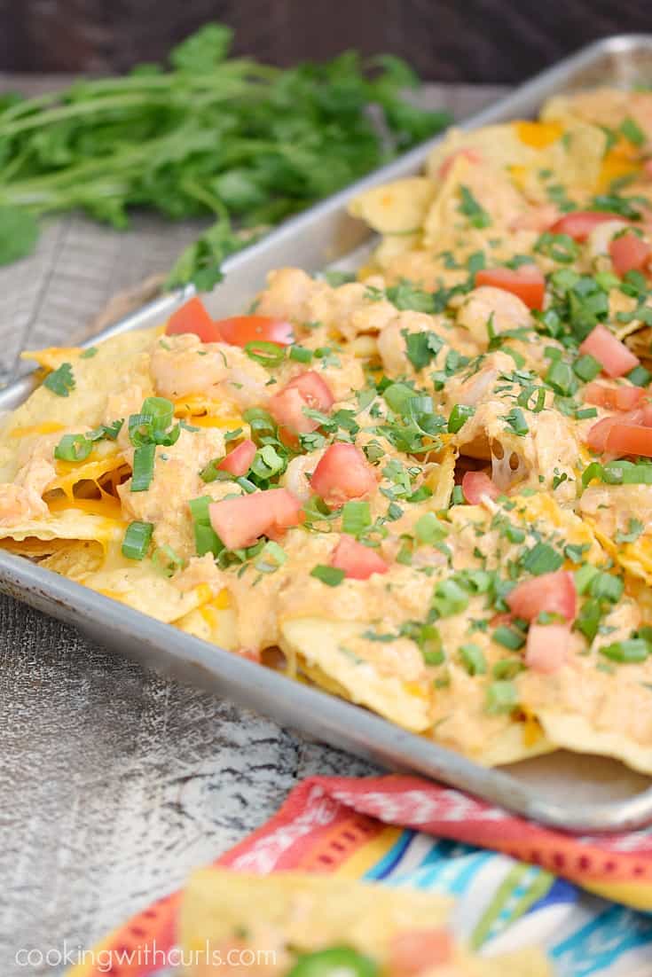 Celebrate Cinco de Mayo with a pan of Creamy Seafood Nachos and watch your guest devour them! cookingwithcurls.com #ad