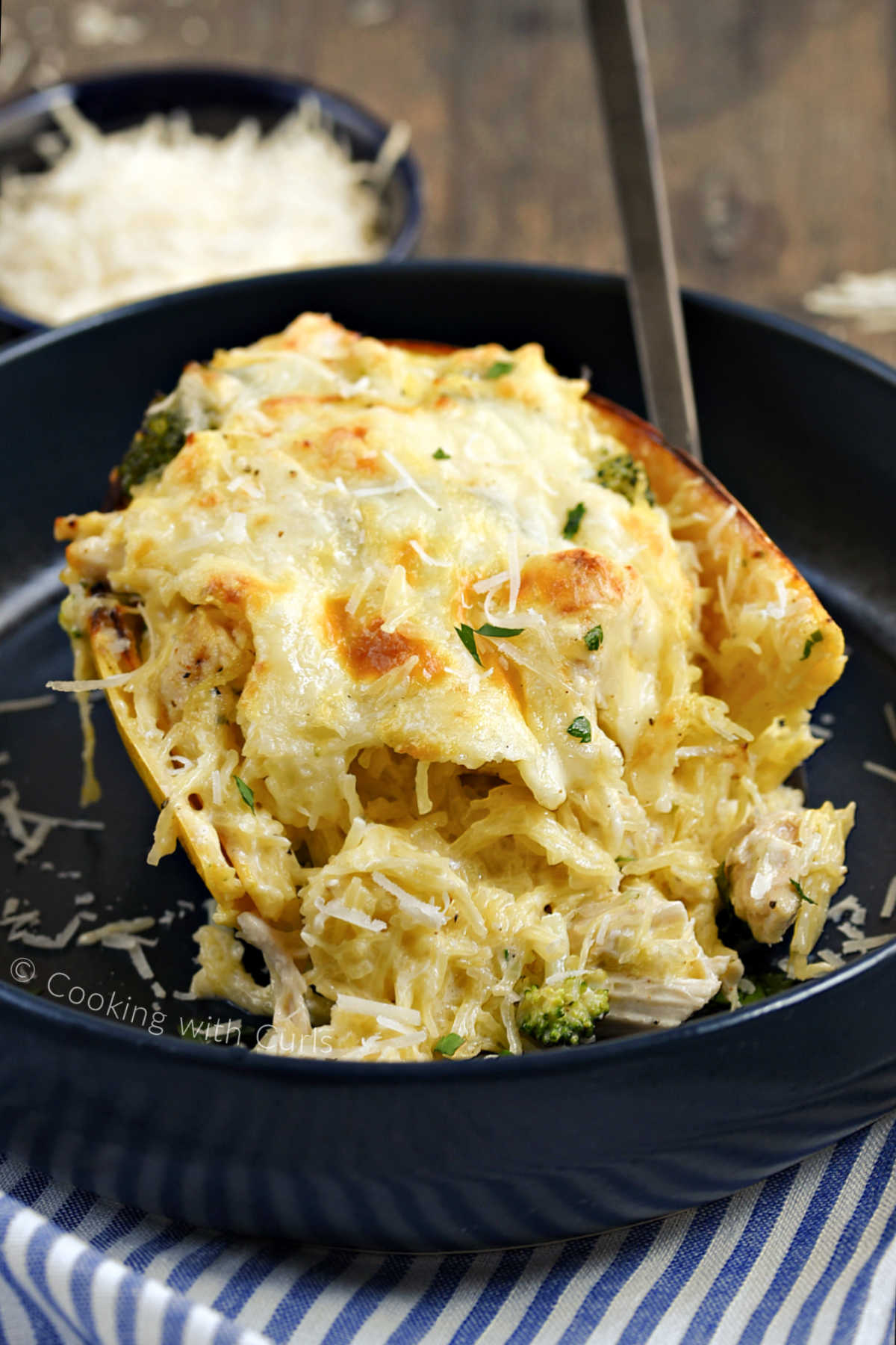 Chicken alfredo spaghetti squash served in squash shell.