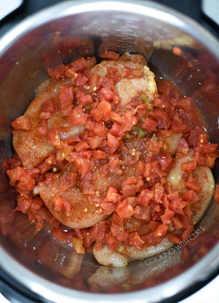 Seasoned chicken and tomatoes in the pressure cooker cookingwithcurls.com