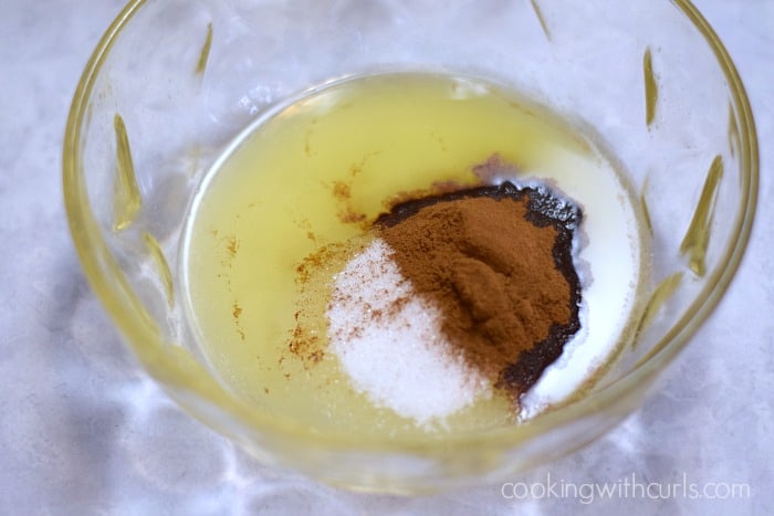 Melted butter, cinnamon, oil, and sugar in mixing bowl.