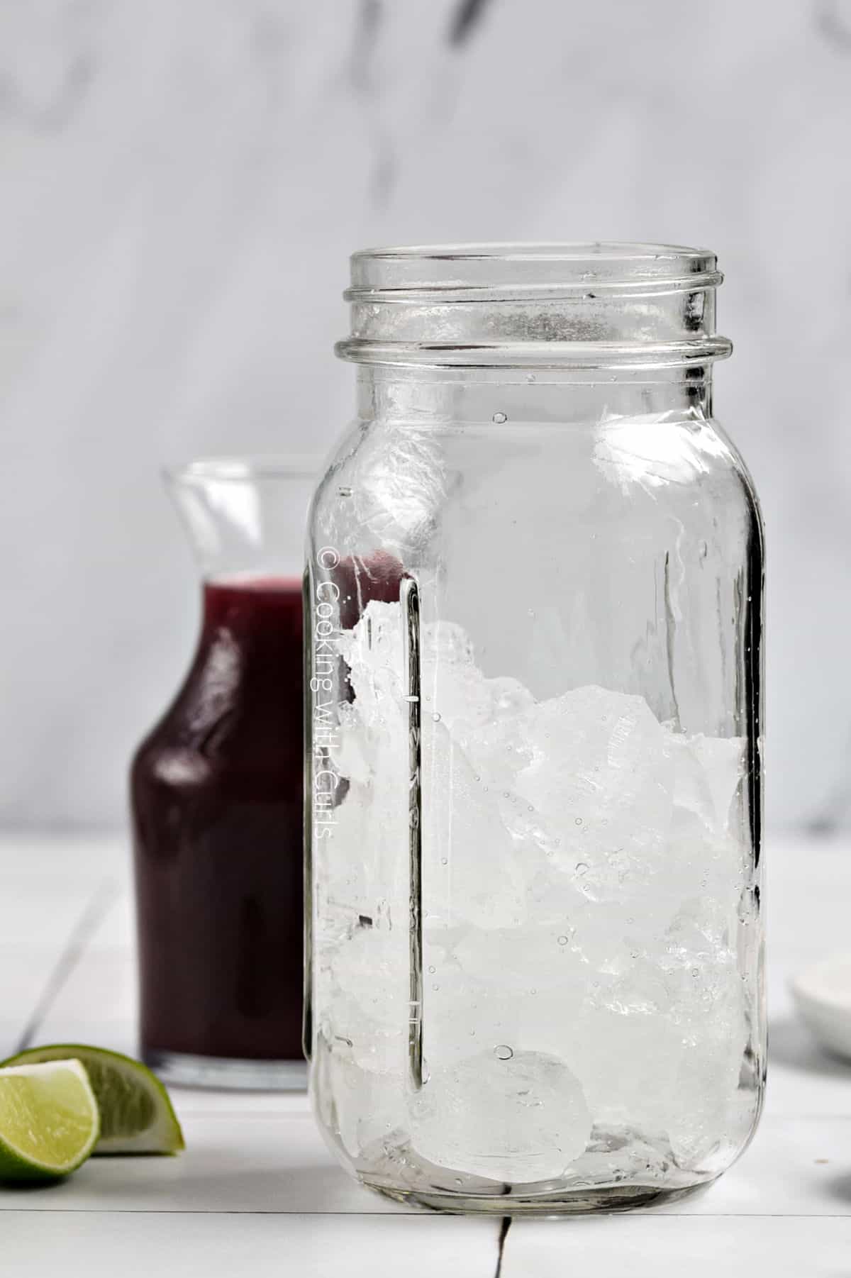 Cocktail shaker filled with ice cubes.