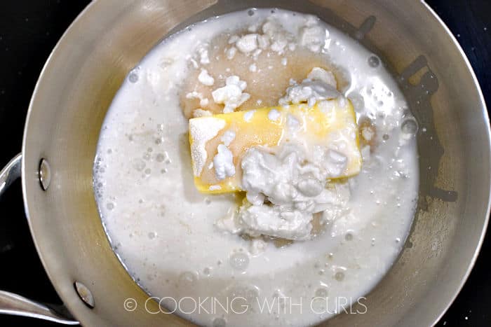 Coconut milk, butter and sugar in a saucepan. 