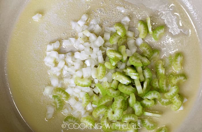 Diced celery and onion with melted butter in a skillet. 