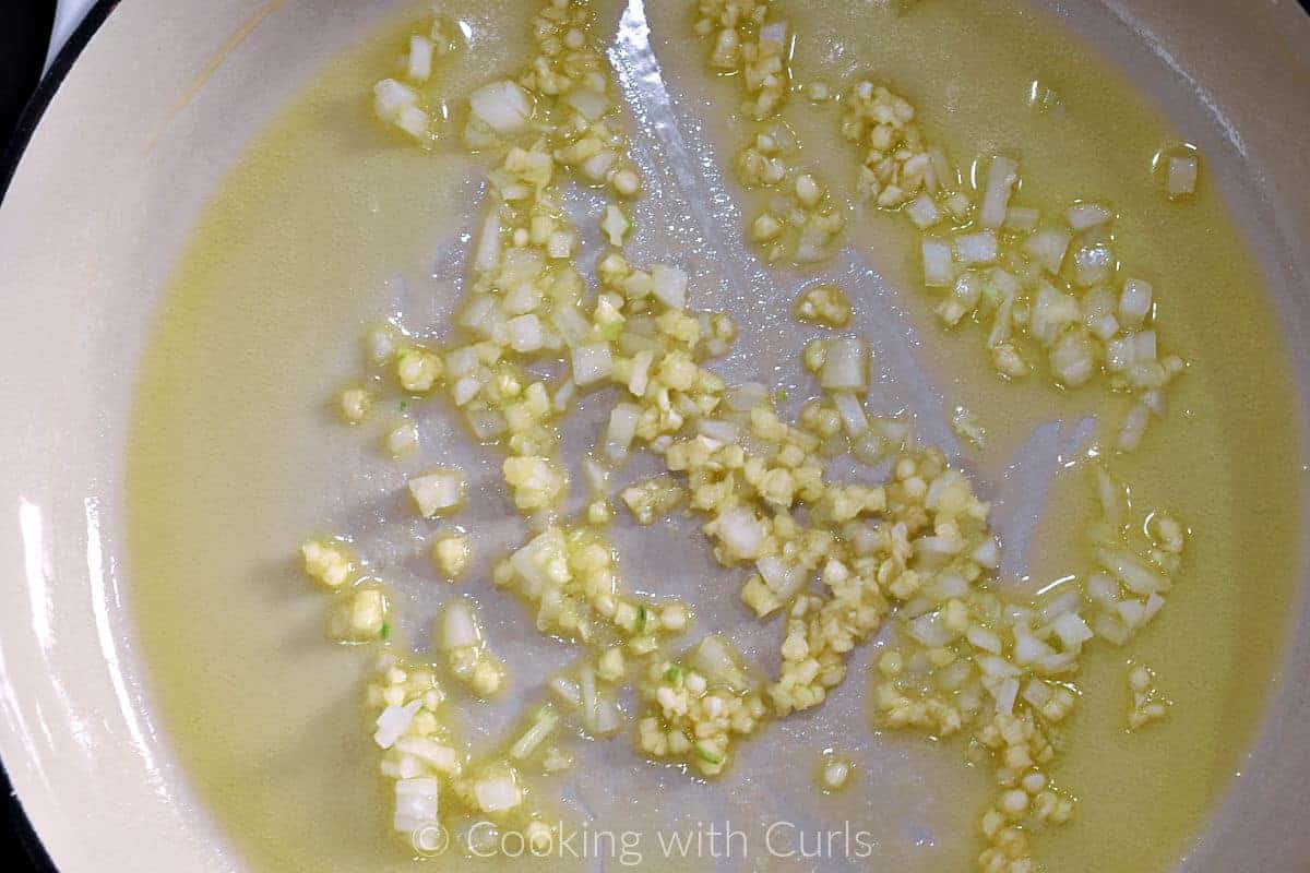 Diced onion and garlic with melted butter in a skillet. 