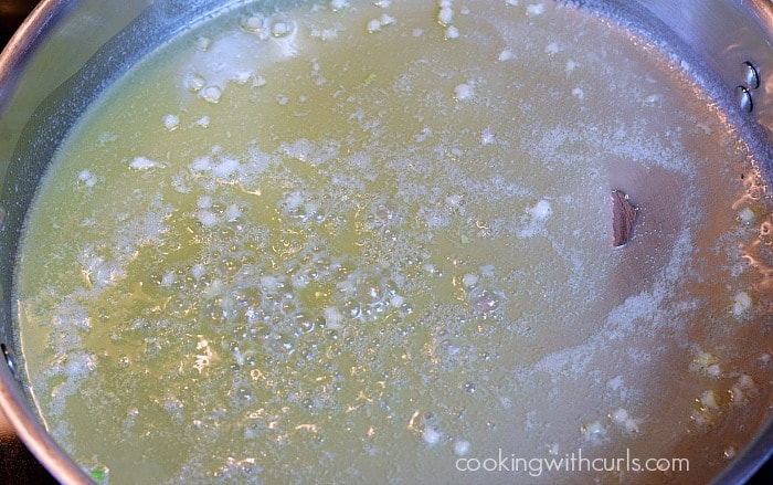 Melted butter and minced garlic in a large skillet.