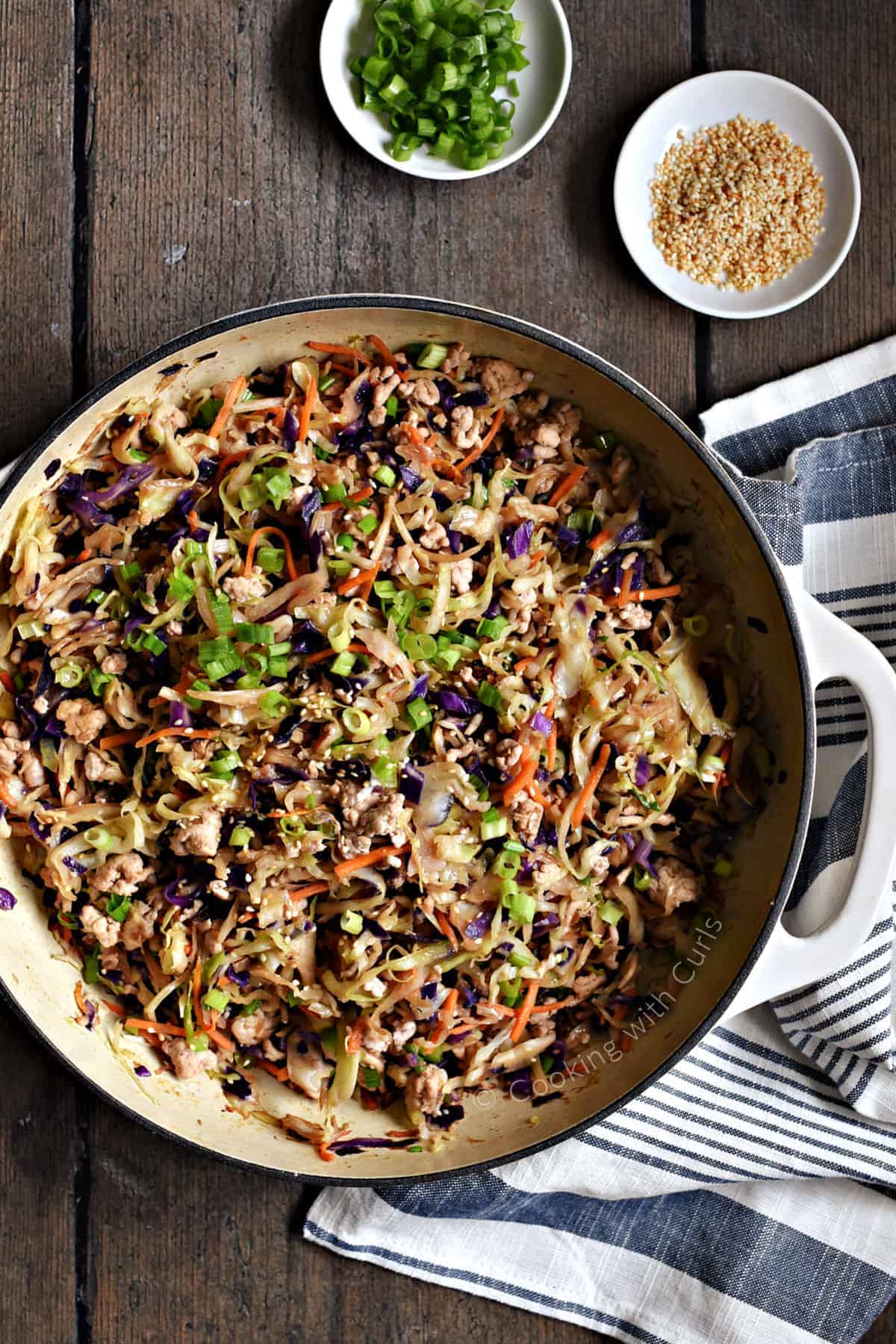 Deconstructed egg roll cooked in a large skillet.