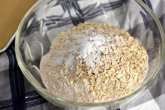 Flour, oats, salt and soda in a large glass bowl. 