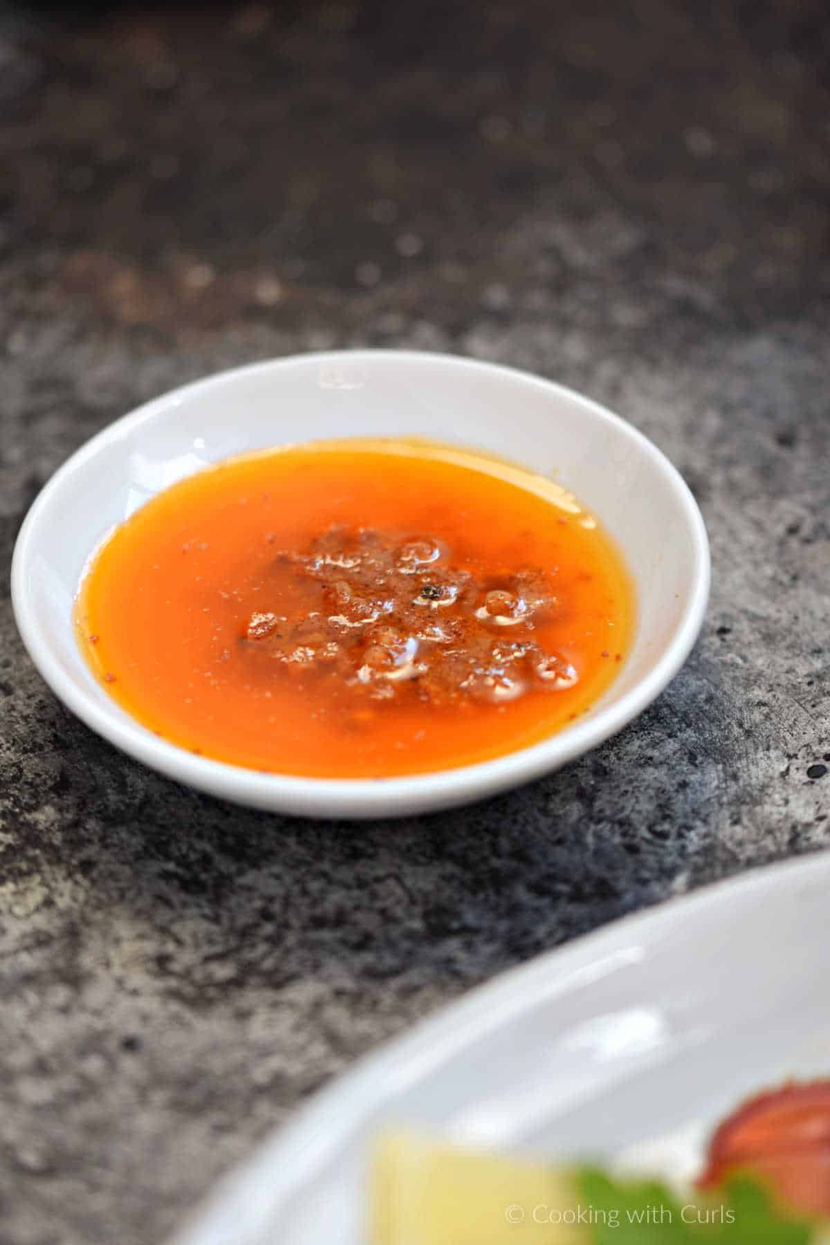 Garlic butter in a small serving bowl.