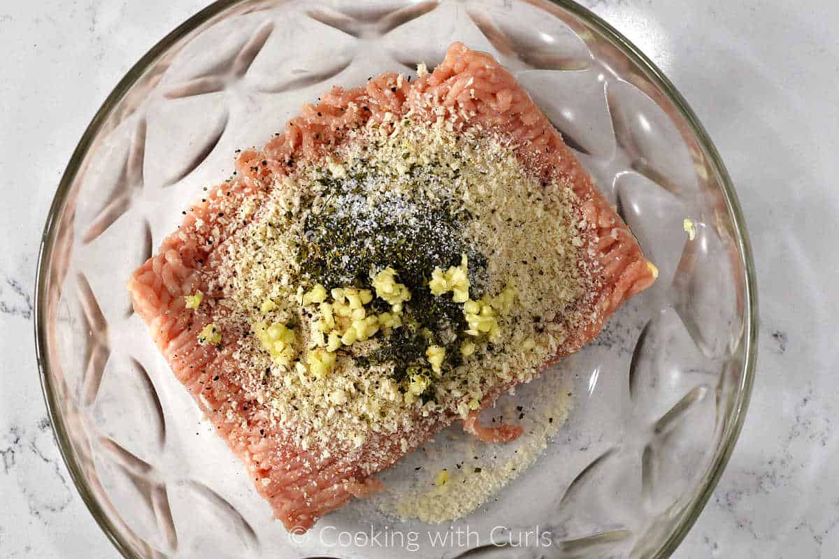 Ground chicken, panko crumbs and seasonings in a large mixing bowl.