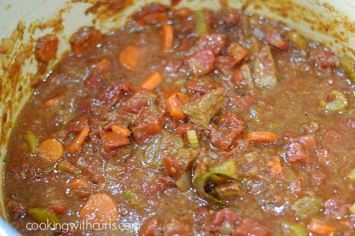 Guinness beef stew simmering away in a Dutch oven.