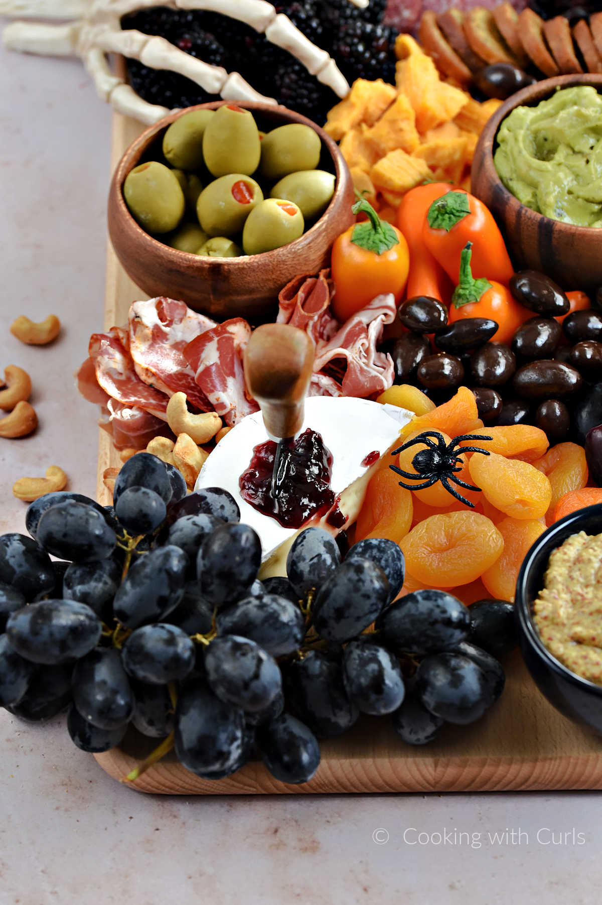 Meat and cheese board with a Halloween theme.