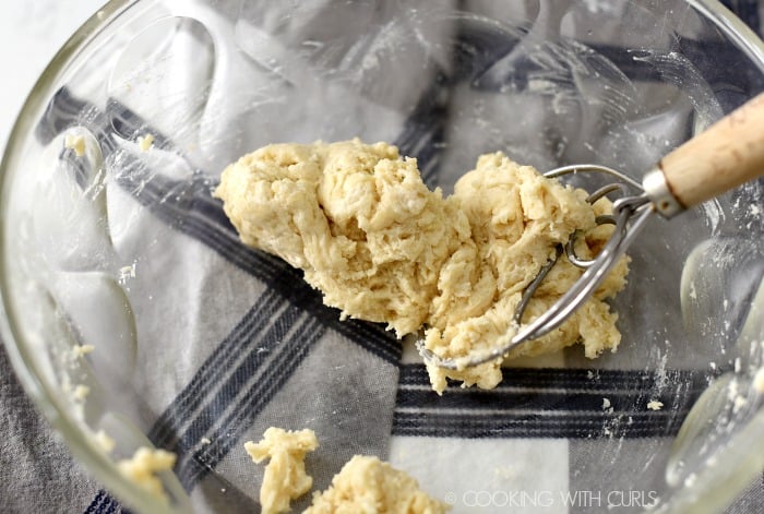 Herb dumpling dough mixed in a large bowl. 