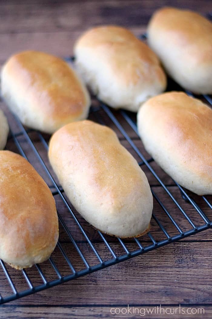 hot dog buns sitting on a wire rack