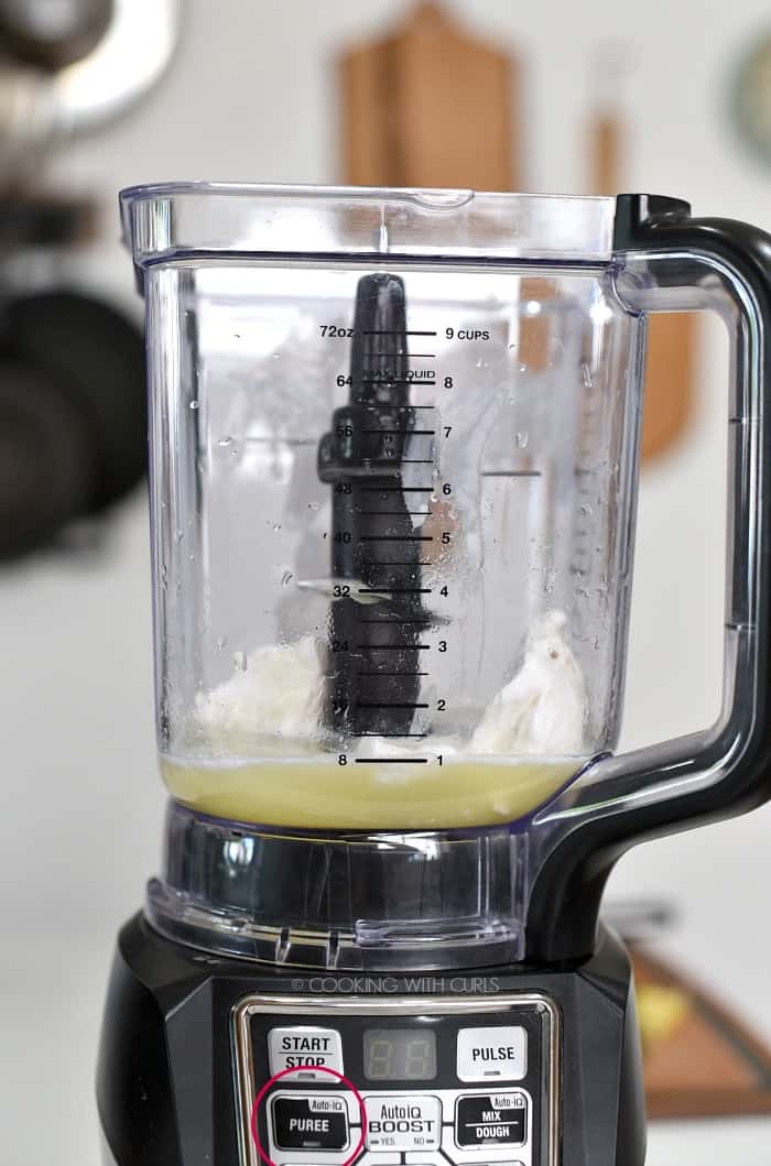 Ice cream, coconut milk, pineapple juice and rum in a blender. 