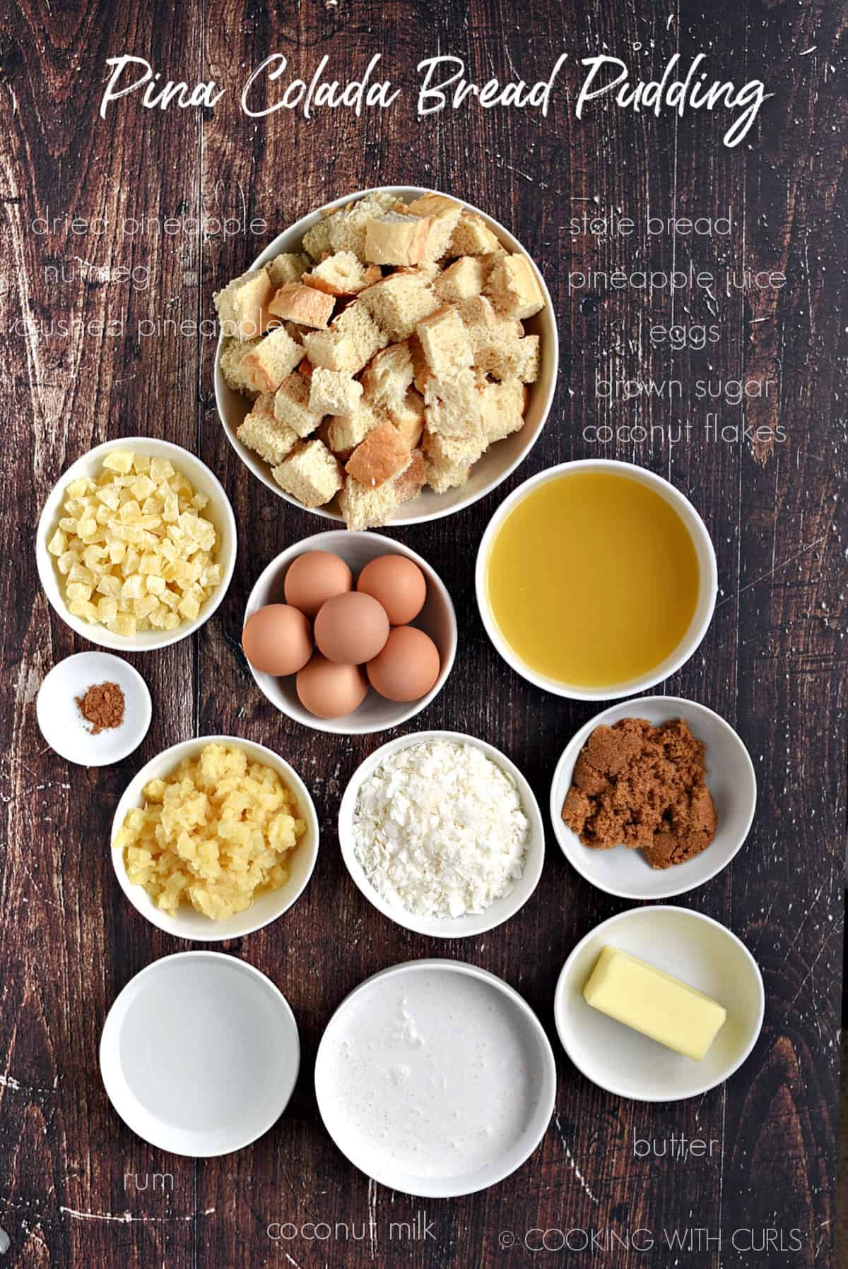 Ingredients to make Pina Colada Bread Pudding all in separate white bowls. 