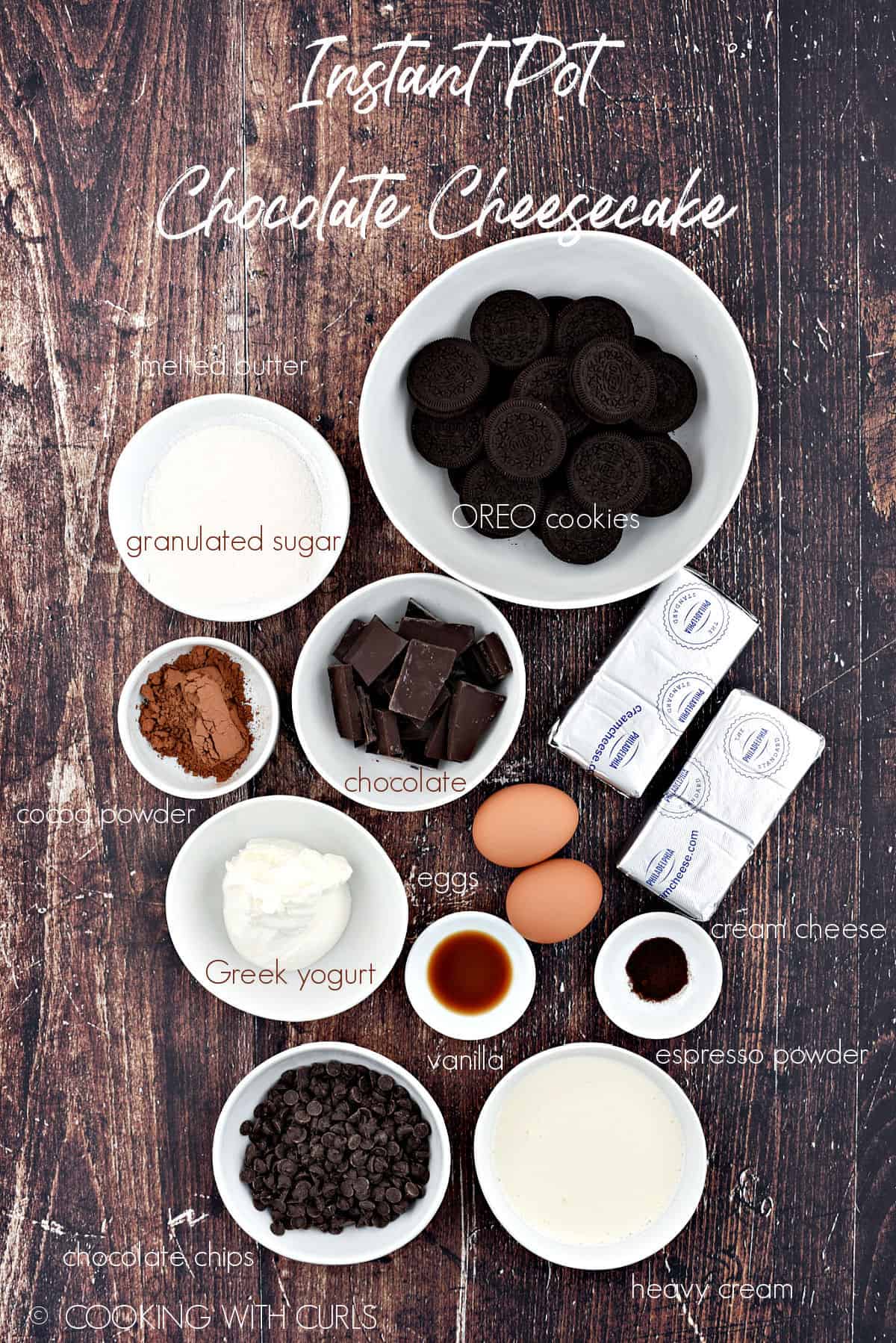 Instant Pot Chocolate Cheesecake ingredients in white bowls on a wooden background. 