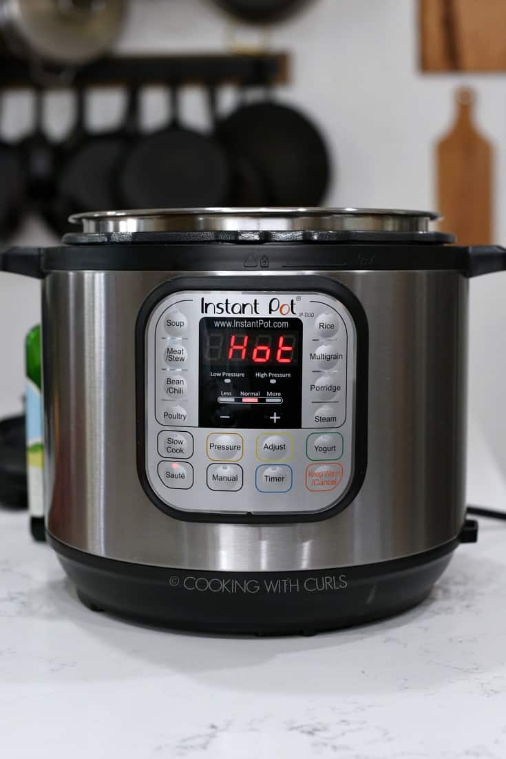 Instant Pot with  HOT on the display.