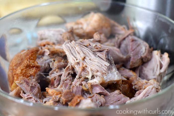 Kalua Pork broken apart in a large bowl.