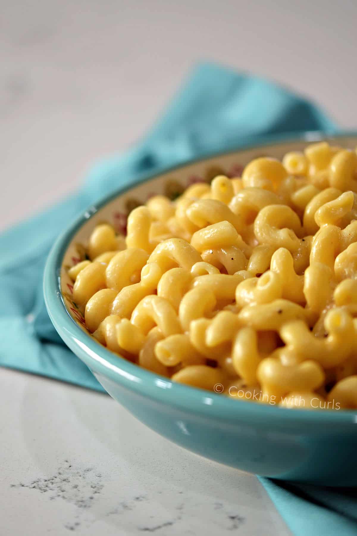 Creamy macaroni and cheese in a large serving bowl.