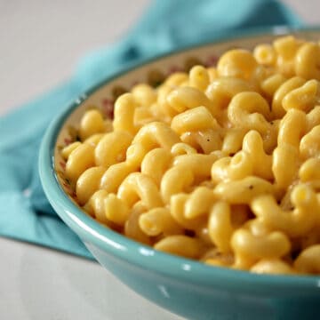 Creamy macaroni and cheese in a large serving bowl.