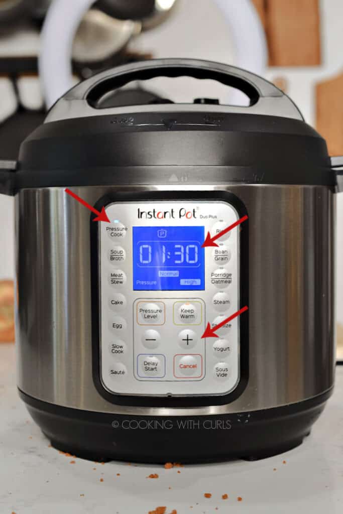Instant Pot set to one hour and 30 minutes with arrows pointing at Pressure Cook, the time and + button. 