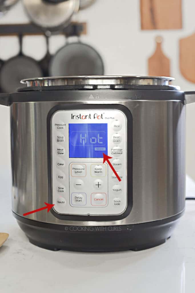 Instant Pot set to Sauté - More with red arrows pointing to each setting. 