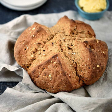 Irish Brown Soda Bread on a beige towel.