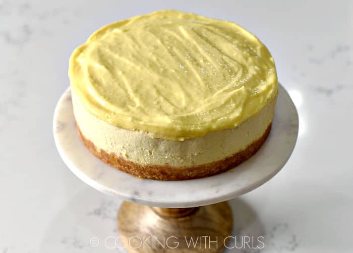 Lemon curd topped Instant Pot Lemon Cheesecake. 