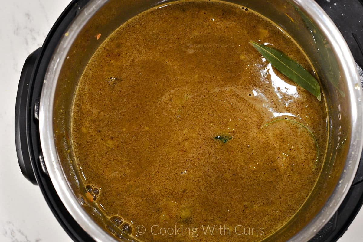 Lentils and two bay leaves added to the soup mixture. 