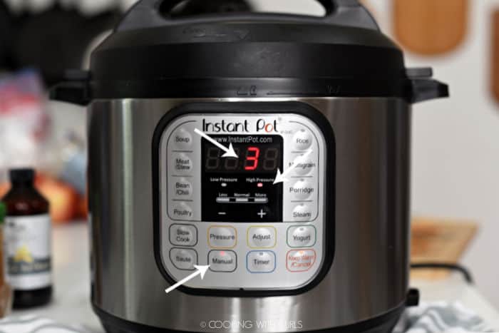 looking at the face of an Instant Pot with white arrows pointing to Manual High Pressure for 3 minutes. 