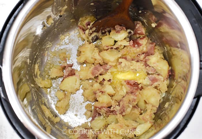 Mashed potatoes and melted butter in a pressure cooker. 