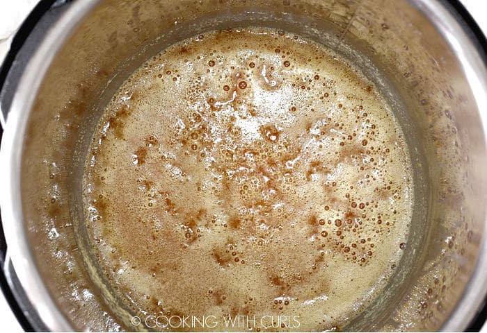 Melted butter simmered to a golden brown color in a pressure cooker. 