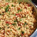 Mexican rice in a white cast iron skillet with title graphic across the top.