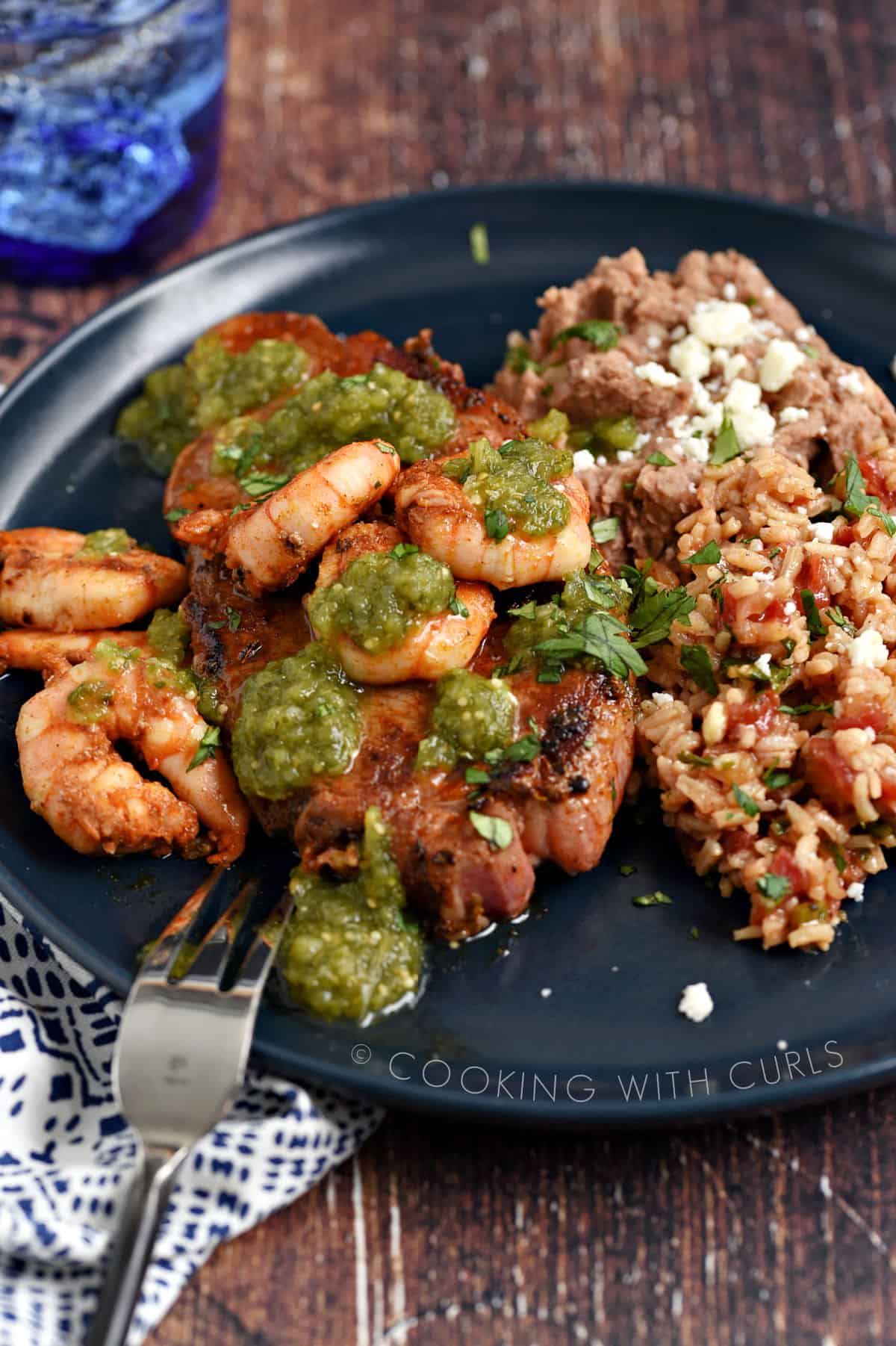 Mexican Seasoning Recipe on grilled steak and shrimp with refried beans and Spanish rice on the side. 