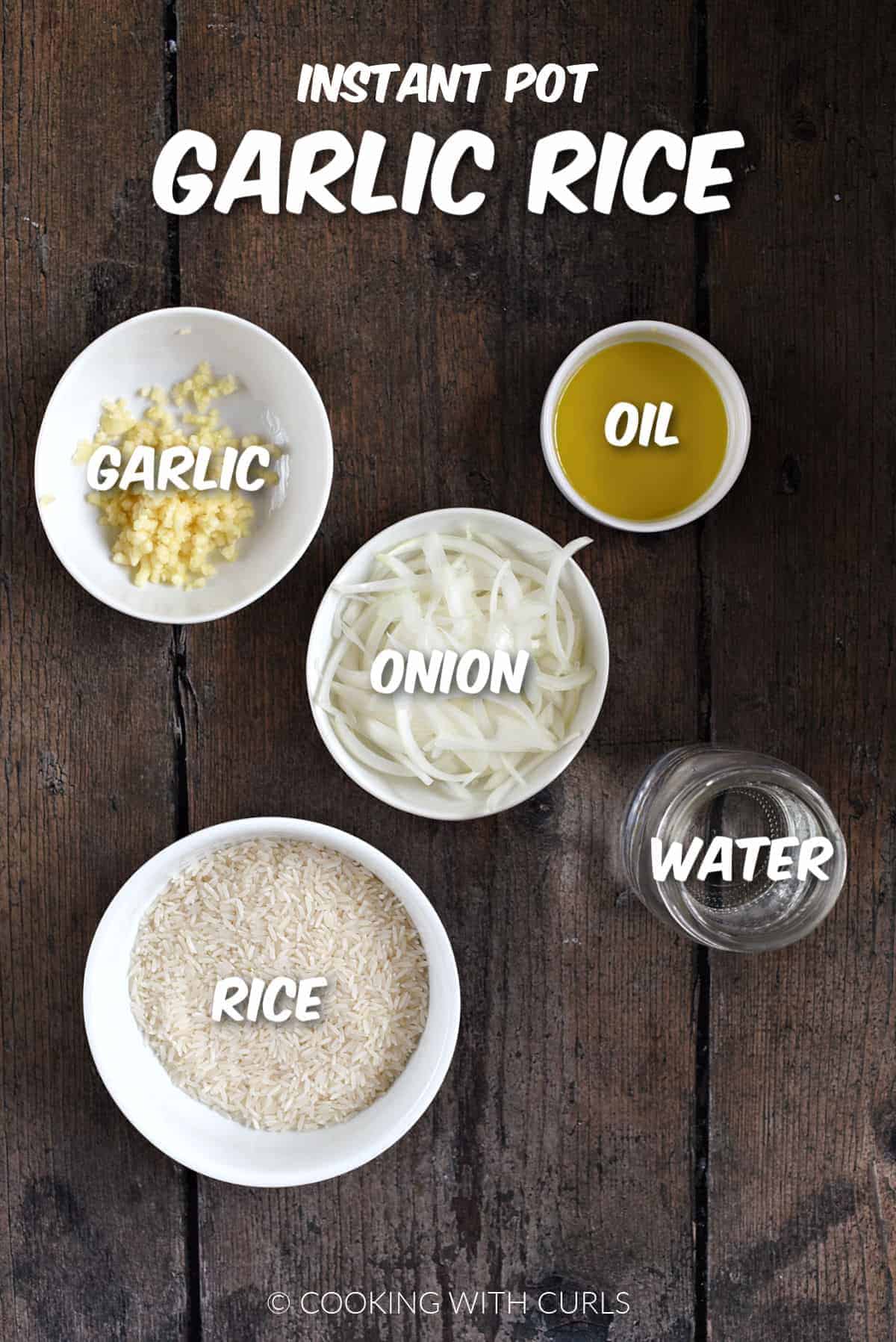Minced garlic, sliced onion, olive oil, water, and rice in bowls.
