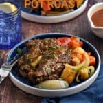 Pot roast topped with gravy and served with chopped red bell peppers, carrots, parsnips and onion wedges on a blue plate with title graphic across the top.