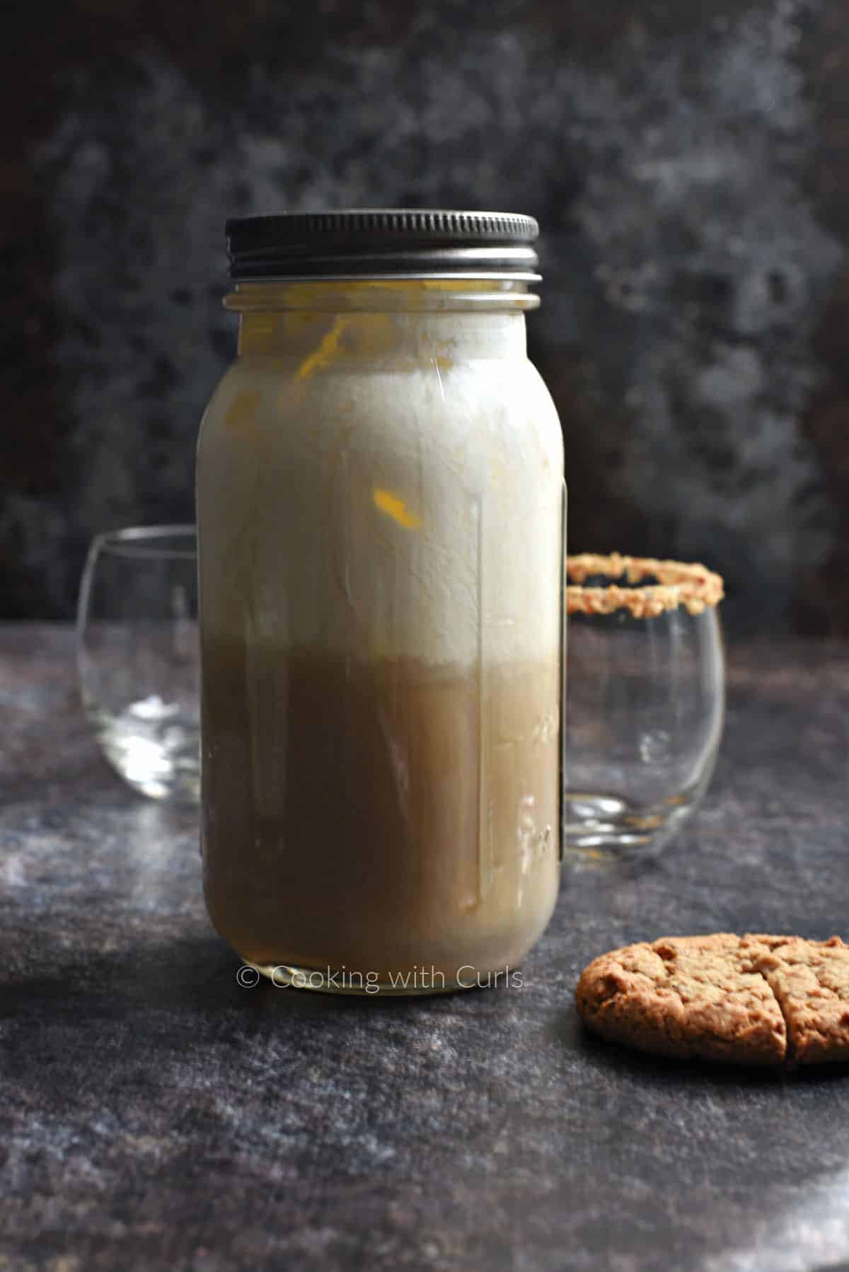 Oatmeal Cookie Cocktail ingredients in a mason jar. 