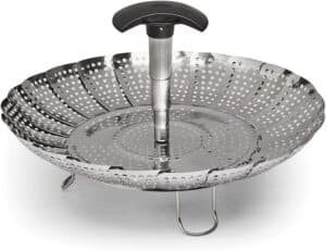 stainless steel expandable steamer with black handle.