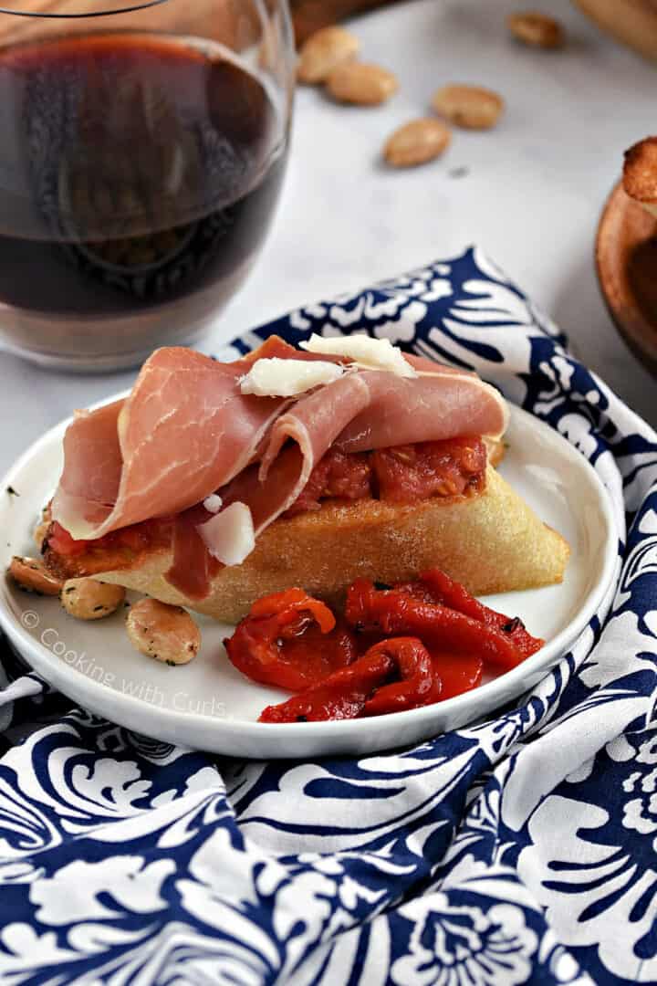 Toasted bread topped with grated ripe tomato, jamon, and manchego cheese.